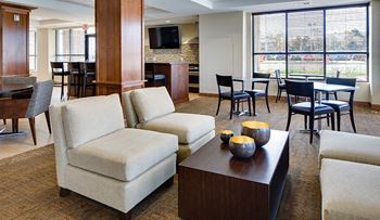Community room with entertainment space, prep kitchen, bar and serving area
